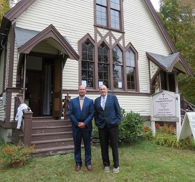 image of two men standing in front of a church