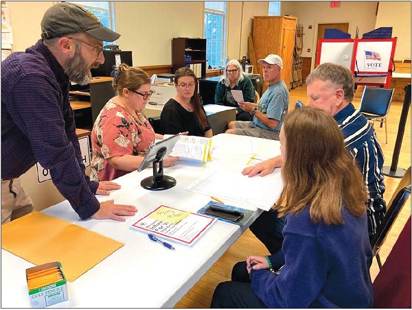 Image of Sandisfield poll workers at the Sandisfield Old Town Hall.