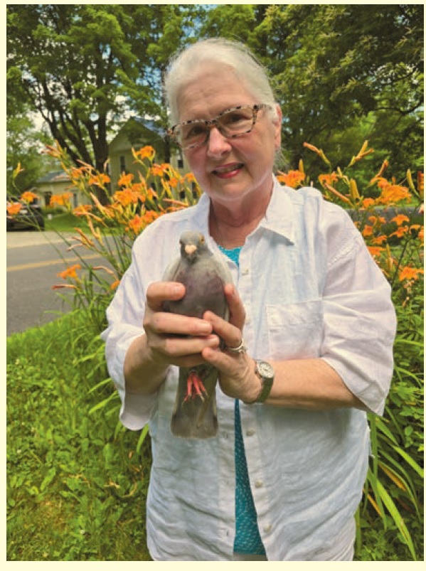 image of Jean holding a pigeon.