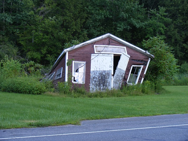 image of a shack falling down.