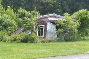image of a shack falling down.